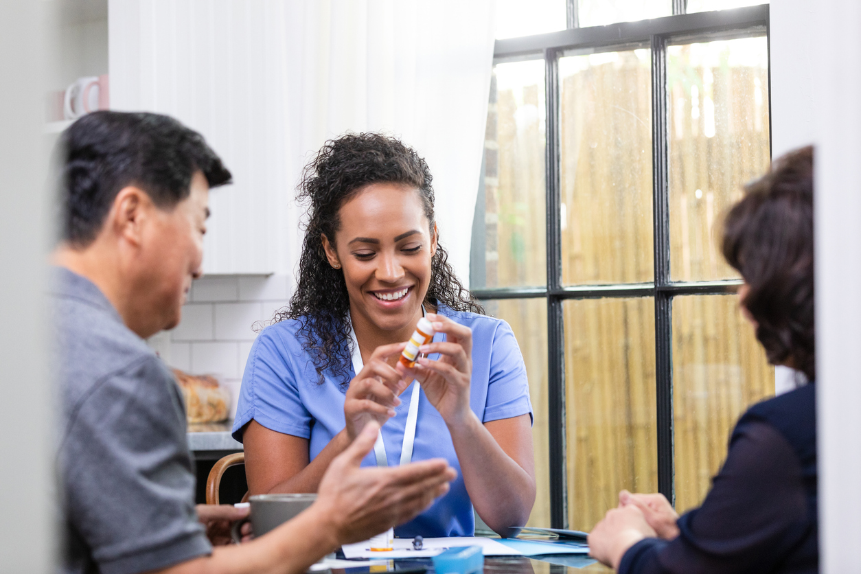 nurse providing in-home assistance with medication management