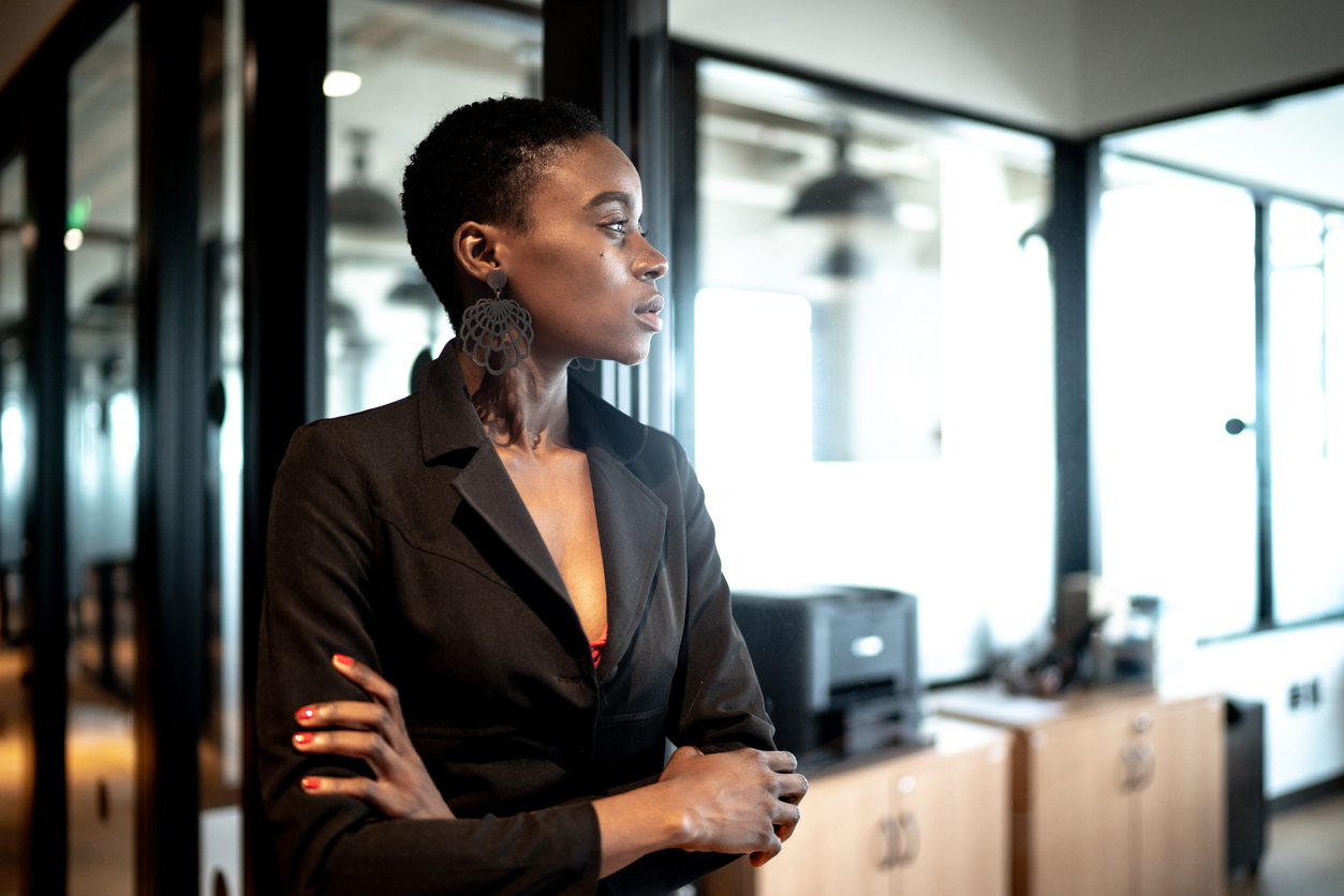 woman with anxiety working in office staring off in space