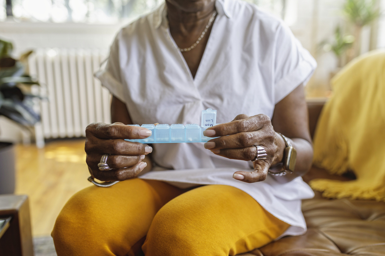 woman-managing-psychiatric-medications-using-pill-box